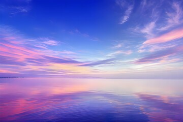 Fototapeta premium 夕暮れ時の静寂な湖面：ピンク、青、オレンジのグラデーションが広がる空と、その色彩が完全に反映される穏やかな水面、そして広大な空とその反射だけが存在する無限の静けさ