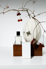 Perfume in a chipped bottle and packaging on a chest