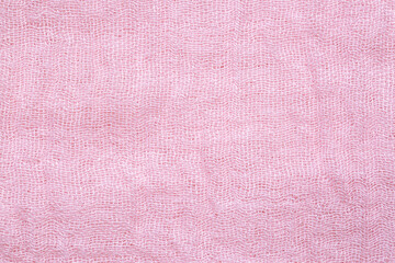 Fototapeta na wymiar Close-up detail of pink fabric, macro, Fabric texture of natural cotton or linen textile material. Blue canvas background. Decorative fabric for upholstery, furniture, walls 