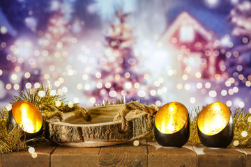 Black and gold christmas candles on wooden big table and free space for your decoration. Wooden...