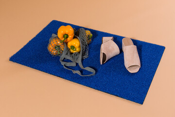 paprika and shoes on blue matt