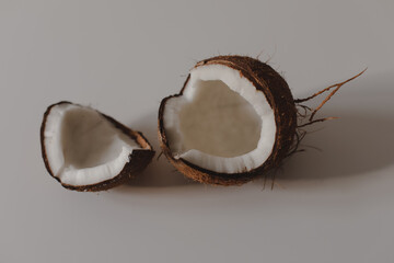 opened coconut pieces isolated on white background