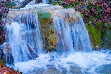 beautiful waterfall on mountain river, autumn mountain river scene