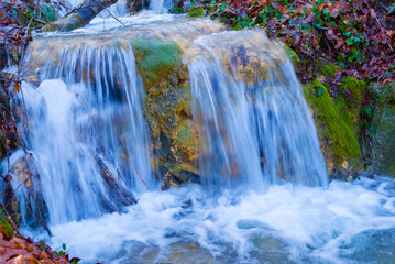 Obraz premium beautiful waterfall on mountain river, autumn mountain river scene
