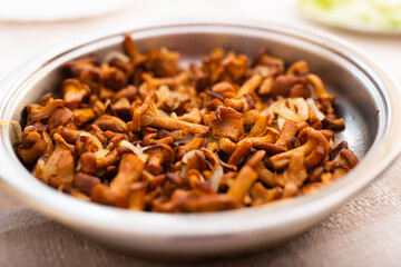 Traditional dishes of Eastern European cuisine. Fried chanterelles in pan