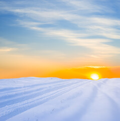 wide snowbound plain at the dramatic sunset