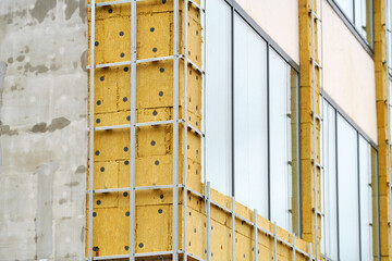 Building renovation, facade wall insulation preparing for cladding. Retrofitting Insulation,...