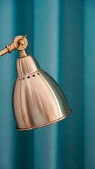A vintage-looking gold bedside lamp