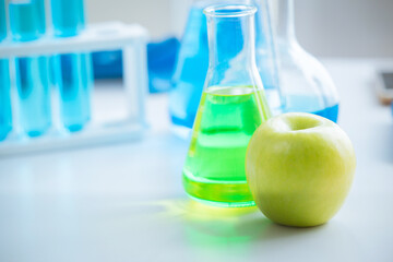 Green Apple in food science lab for high antioxidant bio flavonoid vitamin C nutrition healthcare...