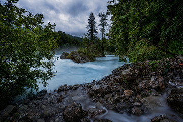 Wild river Soča in cold morning. Amazing blue color but so cold and stormy for swimming in Triglav National Park, Slovenia.