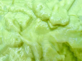 Close up Avocado smoothie isolated shadows background 