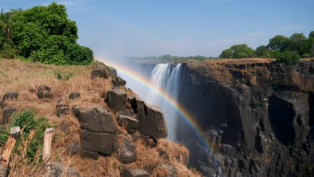 Victoria Falls in Africa. Safari in Africa. Rainbow from small splashes in the sun