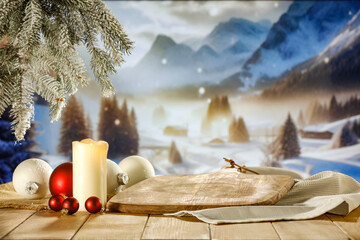 Desk of free space and winter landscape. Lamp decoration with candle 