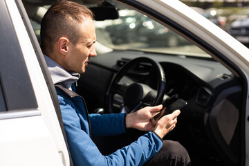 Happy excited millennial man looking at smartphone screen.