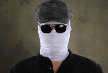 portrait of an invisible man with a bandaged head