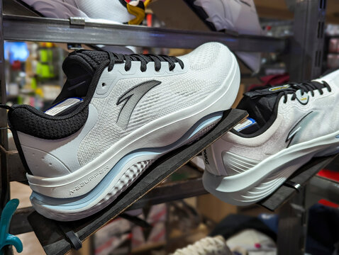 Pasay, Metro Manila, Philippines - Oct 21, 2023: Anta running shoes on display at a sporting goods store at a mall.