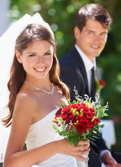 Happy couple, portrait and wedding with bouquet of roses for love, care or just married at outdoor ceremony. Face of bride and groom smile for marriage, engagement or commitment together with flowers