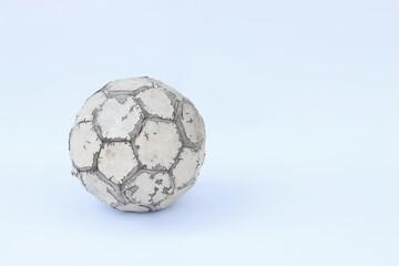 Naklejka premium Old used football or soccer ball isolated on white background