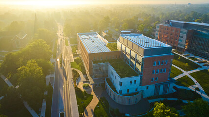 Ball State University foggy morning with golden sunlight over buildings, Muncie, Indiana
