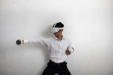 A man wearing a white shirt and black trousers who uses VR (Virtual Reality) technology happily....