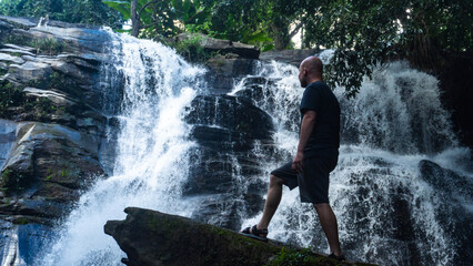 Man at a waterfall