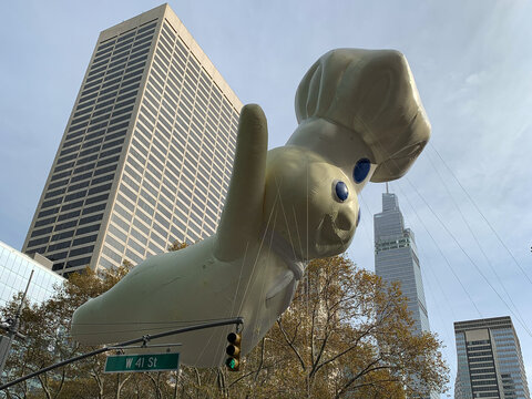 The 95th Annual Macy's Thanksgiving Day Parade Pillsbury Doughboy balloon viewed from Bryant Park