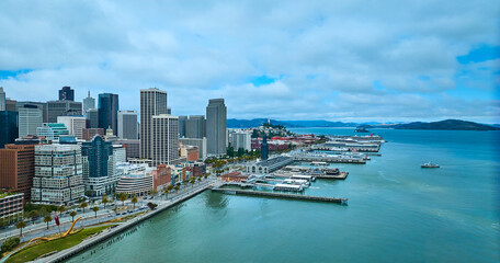 Fototapeta na wymiar San Francisco city aerial The Embarcadero with boats docked in bay and downtown skyscrapers CA