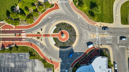 Passing of the Buffalo Native American statue from above in aerial of roundabout on sunny day