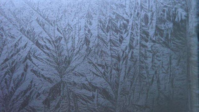 Time Lapse of a freezing window on a cold winter day