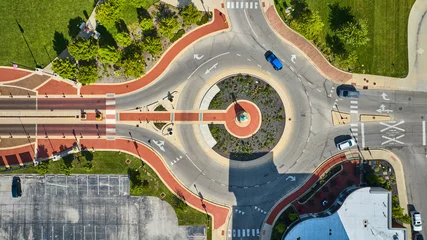 Zelfklevend Fotobehang Native American statue Passing of the Buffalo from above in aerial of roundabout on sunny day © Nicholas J. Klein