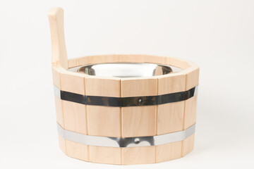 Wooden ladle bucket isolated on white background. Wooden utensils for sauna and bathhouse