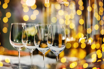 A glass of champagne on table with blur light in restaurant.