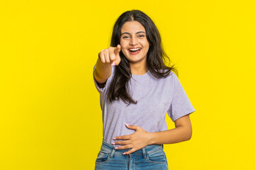 Happy Indian young woman laughing out loud after hearing ridiculous anecdote, reaction on funny...