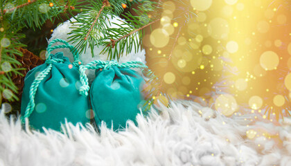 Fototapeta na wymiar Gift bags under the Christmas tree. Background for New Year and Christmas
