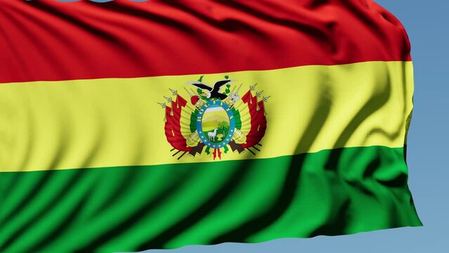 Close-up of the national flag of bolivia flutters in the wind on a sunny day , 4k slow motion