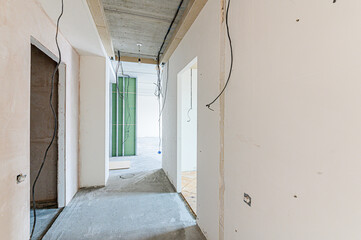 interior apartment rough repair for self-finishing. interior decoration, bare walls of the room, stage of construction