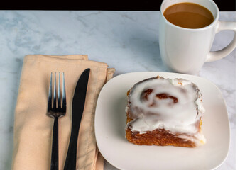 cinnamon roll   with a cup of coffee