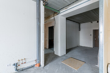 interior apartment rough repair for self-finishing. interior decoration, bare walls of the room, stage of construction