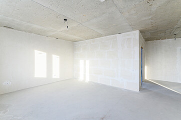 interior apartment rough repair for self-finishing. interior decoration, bare walls of the room, stage of construction