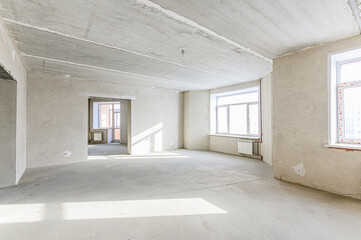 Fototapeta premium interior apartment rough repair for self-finishing. interior decoration, bare walls of the room, stage of construction