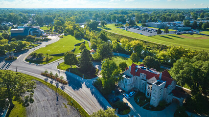 Mansion at Minnetrista Museum and Gardens on bright and sunny summer day aerial of city