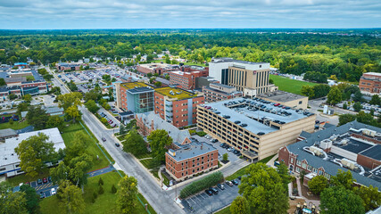 Ball State University, Muncie IN with green rooftop and parking garage in middle of campus aerial