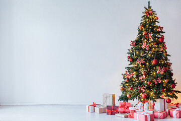 Christmas tree with gifts and toys in the interior for the new year