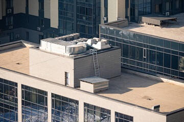 A flat roof with air conditioning and an air vent system at the top.