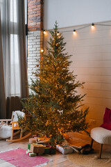 Minimalistic design of the Christmas tree in the living room by the window