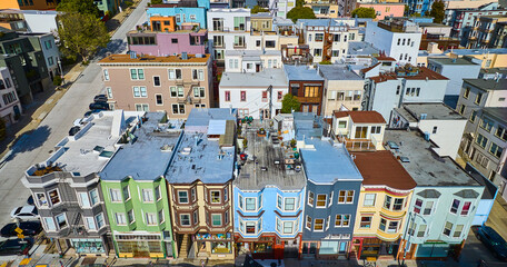 Fototapeta premium Seven colorful and unique apartment buildings in San Francisco neighborhood on sunny day aerial, CA
