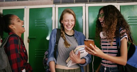 Students, group and phone at high school locker for social media, funny chat or reading post on internet. Excited friends, teenager or youth laughing on mobile for e learning meme or streaming video - Powered by Adobe