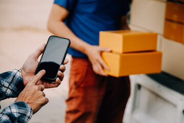 Business woman start up small business entrepreneur SME success .freelance woman working at home with Online Parcel delivery. SME and packaging deliveryconcept