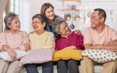 Portrait happy elderly people, doctor talking together, consulting mental health, smiling with happiness, sitting in indoor nursing home, community. Retirement, Healthcare Concept.