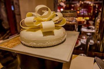 Assortment baked pastry in the buffet. Various different types of sweet cakes, cookies, candies, fruits and other desserts on display. Catering for birthday, wedding, Sunday brunch or other event